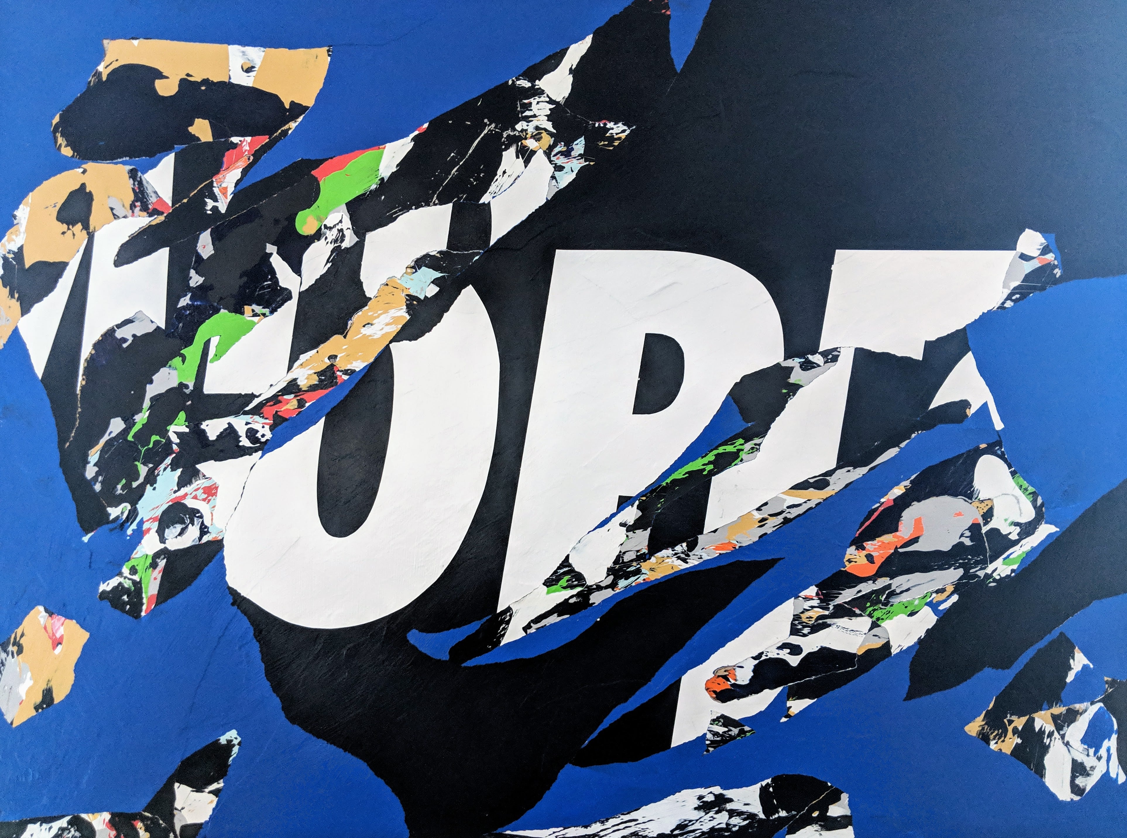 Abstract collage of torn blue, black, and multicolored textures layered over bold white letters.